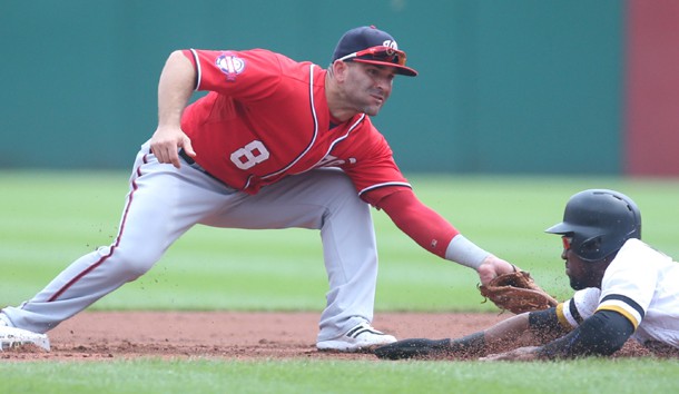 Jul 26, 2015; Pittsburgh, PA, USA; Washington Nationals second baseman Danny Espinosa (8) tags out Pittsburgh Pirates left fielder Starling Marte (R) attempting to steal second base during the first inning at PNC Park. Mandatory Credit: Charles LeClaire-USA TODAY Sports