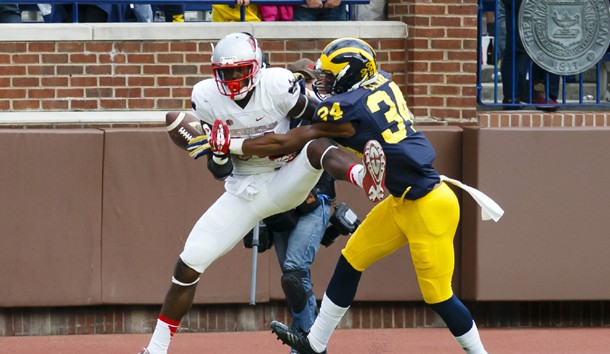 Sep 19, 2015; Ann Arbor, MI, USA; Michigan Wolverines safety Jeremy Clark (34) breaks up a pass to UNLV Rebels wide receiver Kendal Keys (84) in the fourth quarter at Michigan Stadium. Mandatory Credit: Rick Osentoski-USA TODAY Sports