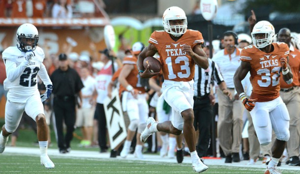 Sep 12, 2015; Austin, TX, USA; Texas Longhorns quarterback Jerrod Heard (13) runs the ball against the Rice Owls during the first quarter at Darrell K Royal-Texas Memorial Stadium. Mandatory Credit: Brendan Maloney-USA TODAY Sports
