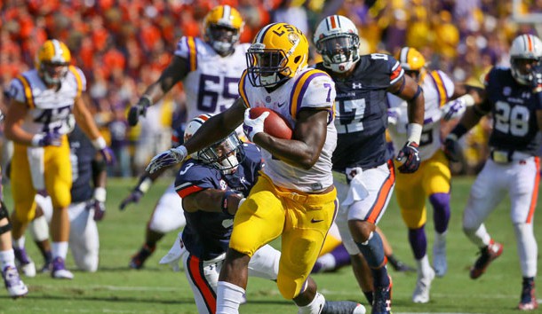 Sep 19, 2015; Baton Rouge, LA, USA; LSU Tigers running back Leonard Fournette (7) breaks a tackle by Auburn Tigers defensive back Jonathan Jones (3) during the second quarter of a game at Tiger Stadium. Mandatory Credit: Derick E. Hingle-USA TODAY Sports