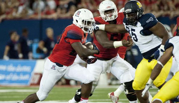 Sep 19, 2015; Tucson, AZ, USA; Arizona Wildcats running back Nick Wilson (28) runs the ball during the second quarter against the Northern Arizona Lumberjacks at Arizona Stadium. Mandatory Credit: Casey Sapio-USA TODAY Sports