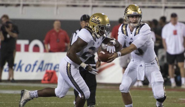 Sep 12, 2015; Las Vegas, NV, USA; UCLA Bruins quarterback Josh Rosen (3) hands the ball off to running back Paul Perkins (24) in the first quarter against the UNLV Rebels at Sam Boyd Stadium. Mandatory Credit: Joshua Dahl-USA TODAY Sports