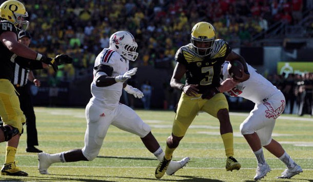 Sep 5, 2015; Eugene, OR, USA; Oregon Ducks quarterback Vernon Adams Jr. (3) runs the ball past Eastern Washington Eagles linebacker Alek Kacmarcik (35) at Autzen Stadium. Scott Olmos-USA TODAY Sports