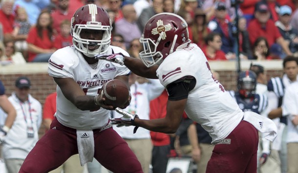 Oct 10, 2015; Oxford, MS, USA; New Mexico State Aggies quarterback Nick Jeanty (12) hands the ball off to running back Larry Rose III (3) during the game at Vaught-Hemingway Stadium. Photo Credit: Justin Ford-USA TODAY Sports