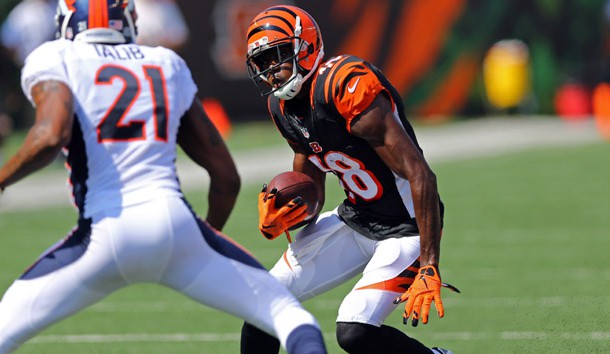 Sep 25, 2016; Cincinnati, OH, USA; Cincinnati Bengals wide receiver A.J. Green (18) makes a move past Denver Broncos cornerback Aqib Talib (21) in the first half at Paul Brown Stadium. Photo Credit: Aaron Doster-USA TODAY Sports