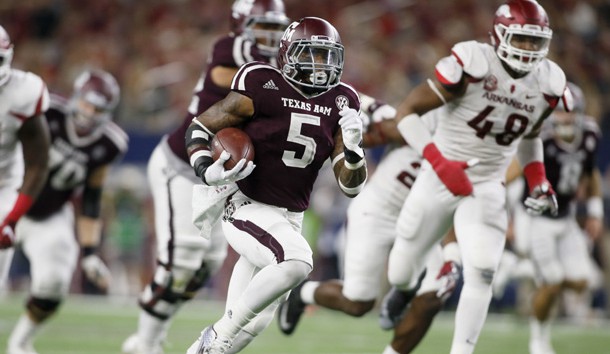 Sep 24, 2016; Dallas, TX, USA; Texas A&M Aggies running back Trayveon Williams (5) runs for a touchdown in the fourth quarter against Arkansas Razorbacks defensive lineman Deatrich Wise Jr. (48) at AT&T Stadium. Photo Credit: Tim Heitman-USA TODAY Sports