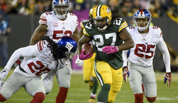 Oct 9, 2016; Green Bay, WI, USA; Green Bay Packers running back Eddie Lacy (27) breaks free for a first down against New York Giants cornerback Janoris Jenkins (20) and cornerback Leon Hall (25) in the second quarter at Lambeau Field. Photo Credit: Benny Sieu-USA TODAY Sports
