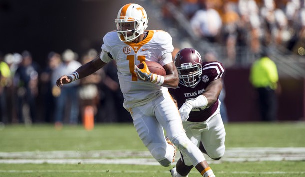 Oct 8, 2016; College Station, TX, USA; Tennessee Volunteers quarterback Joshua Dobbs (11) eludes Texas A&M Aggies defensive lineman Jarrett Johnson (40) during the first quarter at Kyle Field. Photo Credit: Jerome Miron-USA TODAY Sports