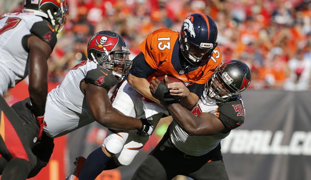 Oct 2, 2016; Tampa, FL, USA; Tampa Bay Buccaneers defensive tackle Akeem Spence (97) and defensive tackle Clinton McDonald (98) tackle Denver Broncos quarterback Trevor Siemian (13) during the first half at Raymond James Stadium. Photo Credit: Kim Klement-USA TODAY Sports