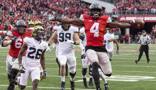 Nov 26, 2016; Columbus, OH, USA; Ohio State Buckeyes running back Curtis Samuel (4) scores the winning touchdown in the second overtime under pursuit from Michigan Wolverines cornerback Jourdan Lewis (26) at Ohio Stadium. Ohio State won the game 30-27 in double overtime. Photo Credit: Greg Bartram-USA TODAY Sports