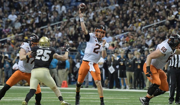 Dec 29, 2016; San Antonio, TX, USA; Oklahoma State Cowboys quarterback Mason Rudolph (2) throws a 23-yard touchdown pass in the third quarter against the Colorado Buffaloes during the 2016 Alamo Bowl at Alamodome. Photo Credit: Kirby Lee-USA TODAY Sports