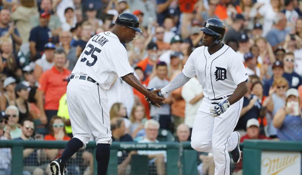 Detroit Tigers left fielder Justin Upton (8) receives congratulations from third base coach Dave Clark (25) after he hit a home run in the second inning against the Minnesota Twins at Comerica Park. Photo Credit: Rick Osentoski-USA TODAY Sports