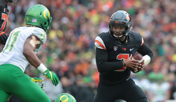 Nov 26, 2016; Corvallis, OR, USA; Oregon State Beavers quarterback Marcus McMaryion (3) runs the ball against Oregon Ducks defensive lineman Justin Hollins (11) at Reser Stadium. Photo Credit: Scott Olmos-USA TODAY Sports