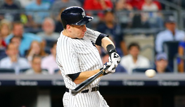 Aug 11, 2017; Bronx, NY, USA; New York Yankees third baseman Todd Frazier (29) hits an RBI single against the Boston Red Sox during the eighth inning at Yankee Stadium. Photo Credit: Andy Marlin-USA TODAY Sports