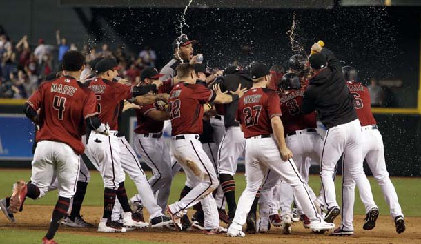 Sep 24, 2017; Phoenix, AZ, USA; The Arizona Diamondbacks celebrate after defeating the Miami Marlins 3-2 and earning a play-off spot at Chase Field. Photo Credit: Rick Scuteri-USA TODAY Sports
