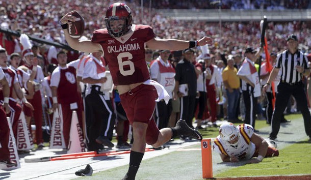 Oct 7, 2017; Norman, OK, USA; Oklahoma Sooners quarterback Baker Mayfield (6) scores a touchdown in front of Iowa State Cyclones linebacker Joel Lanning (7) during the second quarter at Gaylord Family - Oklahoma Memorial Stadium. Photo Credit: Mark D. Smith-USA TODAY Sports