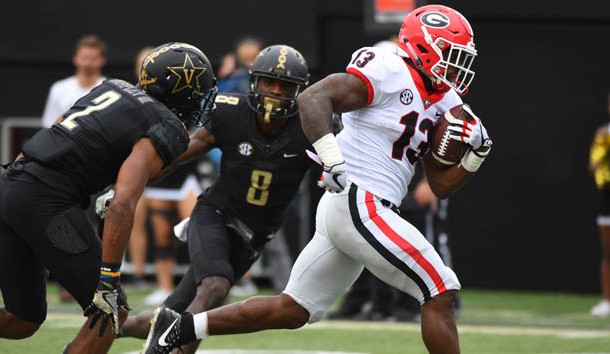 Oct 7, 2017; Nashville, TN, USA; Georgia Bulldogs running back Elijah Holyfield (13) runs for a touchdown during the second half against the Vanderbilt Commodores at Vanderbilt Stadium. Photo Credit: Christopher Hanewinckel-USA TODAY Sports