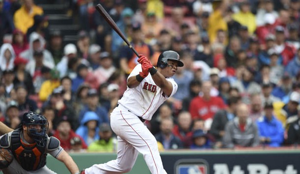 Oct 9, 2017; Boston, MA, USA; Boston Red Sox third baseman Rafael Devers (right) hits a single against Houston Astros catcher Brian McCann (left) during the second inning in game four of the 2017 ALDS playoff baseball series at Fenway Park. Photo Credit: Bob DeChiara-USA TODAY Sports