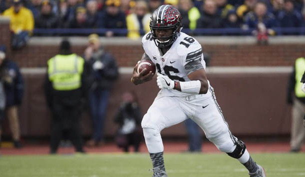 Nov 25, 2017; Ann Arbor, MI, USA; Ohio State Buckeyes quarterback J.T. Barrett (16) rushes in the first half against the Michigan Wolverines at Michigan Stadium. Photo Credit: Rick Osentoski-USA TODAY Sports