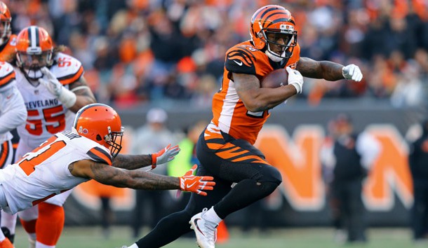 Nov 26, 2017; Cincinnati, OH, USA; Cincinnati Bengals running back Joe Mixon (28) avoids a tackle from Cleveland Browns cornerback Jamar Taylor (21) in the second half at Paul Brown Stadium. Photo Credit: Aaron Doster-USA TODAY Sports