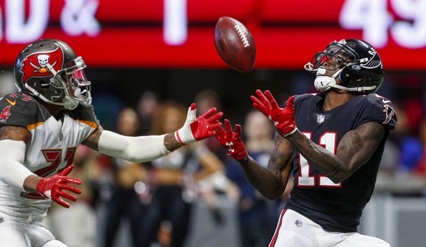 Nov 26, 2017; Atlanta, GA, USA; Atlanta Falcons wide receiver Julio Jones (11) catches a pass for a touchdown over Tampa Bay Buccaneers strong safety Justin Evans (21) during the first half at Mercedes-Benz Stadium. Photo Credit: Butch Dill-USA TODAY Sports