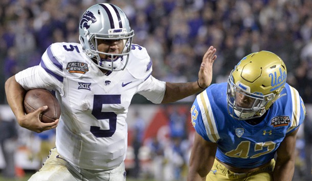 Dec 26, 2017; Phoenix, AZ, USA; Kansas State Wildcats quarterback Alex Delton (5) runs the ball under pressure from UCLA Bruins linebacker Kenny Young (42) during the second half in the 2017 Cactus Bowl at Chase Field. Photo Credit: Casey Sapio-USA TODAY Sports