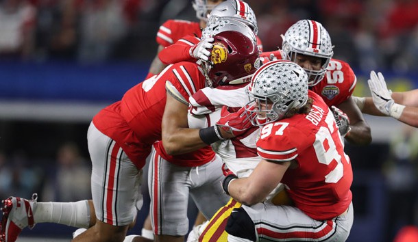 Dec 29, 2017; Arlington, TX, USA; Ohio State Buckeyes defensive end Nick Bosa (97) linebacker Malik Harrison (39) and cornerback Damon Arnette (3) tackle Southern California Trojans running back Ronald Jones II (25) during the fourth quarter in the 2017 Cotton Bowl at AT&T Stadium. Photo Credit: Matthew Emmons-USA TODAY Sports