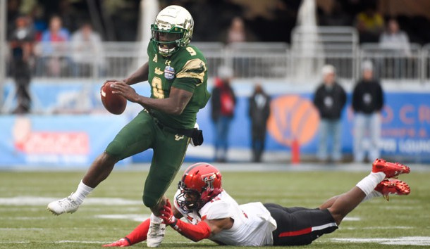 Dec 23, 2017; Birmingham, AL, USA; South Florida Bulls quarterback Quinton Flowers (9) carries the ball Texas Tech Red Raiders defensive back Vaughnte Dorsey (15) during the 4th quarter in the 2017 Birmingham Bowl at Legion Field. Photo Credit: Adam Hagy-USA TODAY Sports