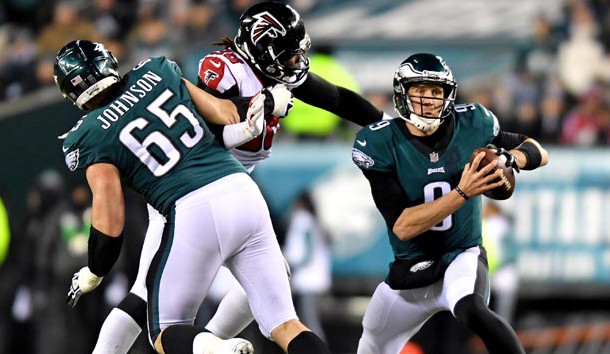 Jan 13, 2018; Philadelphia, PA, USA; Philadelphia Eagles quarterback Nick Foles (9) runs the ball against Atlanta Falcons defensive end Takkarist McKinley (98) during the second quarter in the NFC Divisional playoff game at Lincoln Financial Field. Photo Credit: James Lang-USA TODAY Sports
