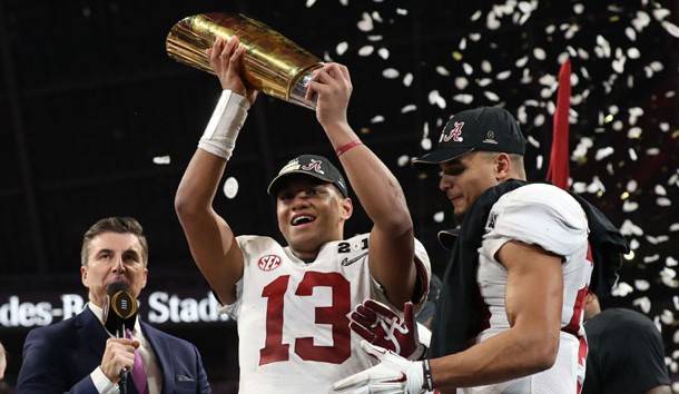 Jan 8, 2018; Atlanta, GA, USA; Alabama Crimson Tide quarterback Tua Tagovailoa (13) celebrates with the trophy after defeating the Georgia Bulldogs 26-23 in the 2018 CFP national championship college football game at Mercedes-Benz Stadium. Photo Credit: Matthew Emmons-USA TODAY Sports