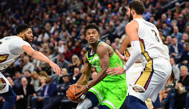 Feb 3, 2018; Minneapolis, MN, USA; Minnesota Timberwolves guard Jimmy Butler (23) goes to the basket as New Orleans Pelicans forward Nikola Mirotic (3) and forward Anthony Davis (23) defend during the second half at Target Center. The Timberwolves won 118-107. Photo Credit: Jeffrey Becker-USA TODAY Sports