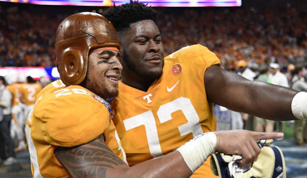 Sep 4, 2017; Atlanta, GA, USA; Tennessee Volunteers linebacker Cortez McDowell (20) wears the old leather helmet as he and offensive lineman Trey Smith (73) react after defeating the Georgia Tech Yellow Jackets at Mercedes-Benz Stadium. Tennessee won 42-41 in two overtimes. Photo Credit: Dale Zanine-USA TODAY Sports