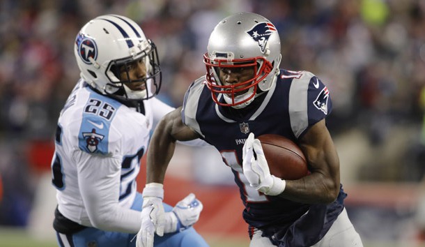 Jan 13, 2018; Foxborough, MA, USA; New England Patriots wide receiver Brandin Cooks (14) runs the ball against Tennessee Titans cornerback Adoree' Jackson (25) during the second quarter in the AFC Divisional playoff game at Gillette Stadium. Photo Credit: David Butler II-USA TODAY Sports