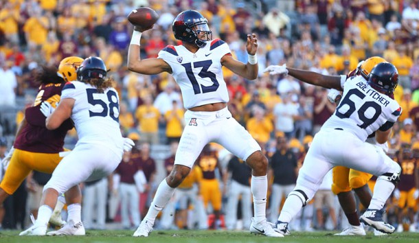 Nov 25, 2017; Tempe, AZ, USA; Arizona Wildcats quarterback Brandon Dawkins (13) throws a pass in the third quarter against the Arizona State Sun Devils during the Territorial Cup at Sun Devil Stadium. Photo Credit: Mark J. Rebilas-USA TODAY Sports