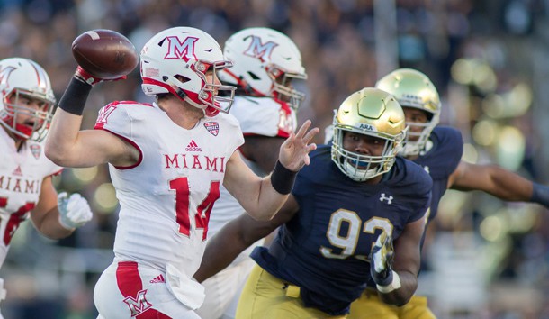 Sep 30, 2017; South Bend, IN, USA; Miami (Oh) Redhawks quarterback Gus Ragland (14) passes the ball as Notre Dame Fighting Irish defensive lineman Jay Hayes (93) defends in the first half at Notre Dame Stadium. Photo Credit: Trevor Ruszkowski-USA TODAY Sports