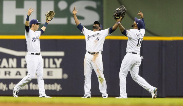 May 22, 2018; Milwaukee, WI, USA; Milwaukee Brewers outfielders Christian Yelich (22) and Lorenzo Cain (6) and Domingo Santana (16) celebrate following the game against the Arizona Diamondbacks at Miller Park. Photo Credit: Jeff Hanisch-USA TODAY Sports