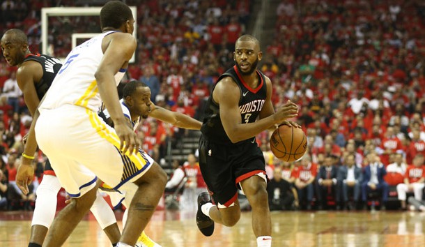May 14, 2018; Houston, TX, USA; Houston Rockets guard Chris Paul (3) dribbles against Golden State Warriors forward Kevon Looney (5) during the second quarter in game one of the Western conference finals of the 2018 NBA Playoffs at Toyota Center. Photo Credit: Troy Taormina-USA TODAY Sports