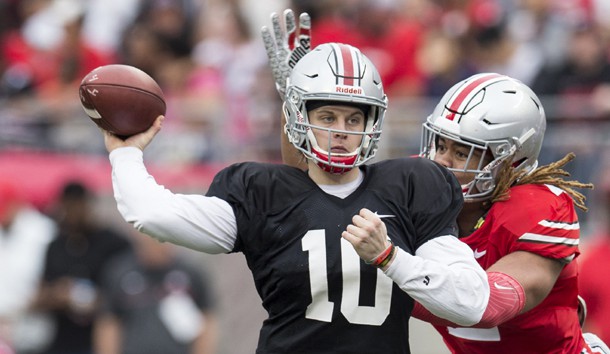 Apr 14, 2018; Columbus, OH, USA;Gray Team quarterback Joe Burrow (10) sends a pass upfield under pressure from Scarlet Team defensive end Chase Young (2) during the Spring Game at Ohio Stadium. Photo Credit: Greg Bartram-USA TODAY Sports