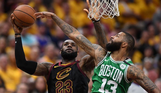 May 21, 2018; Cleveland, OH, USA; Cleveland Cavaliers forward LeBron James (23) attempts a layup in front of Boston Celtics forward Marcus Morris (13) during the third quarter in game four of the Eastern conference finals of the 2018 NBA Playoffs at Quicken Loans Arena. Photo Credit: Ken Blaze-USA TODAY Sports