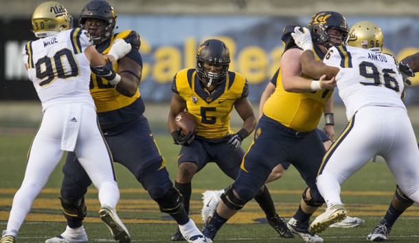 Nov 26, 2016; Berkeley, CA, USA; California Golden Bears running back Tre Watson (5) rushes with the football against UCLA Bruins defensive lineman Eli Ankou (96) and defensive lineman Rick Wade (90) during the first quarter at Memorial Stadium. Photo Credit: Neville E. Guard-USA TODAY Sports