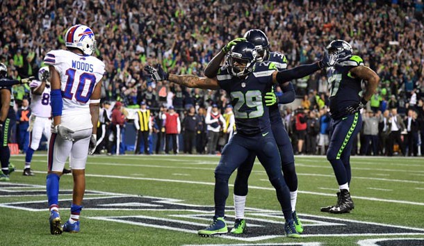 Nov 7, 2016; Seattle, WA, USA; Seattle Seahawks safety Earl Thomas (29) celebrates with safety Kelcie McCray (33) after a Buffalo Bills incomplete pass on fourth down with 13 seconds left as Bills receiver Robert Woods (10) reacts during a NFL football game at CenturyLink Field. The Seahawks defeated the Bills 31-25. Photo Credit: Kirby Lee-USA TODAY Sports