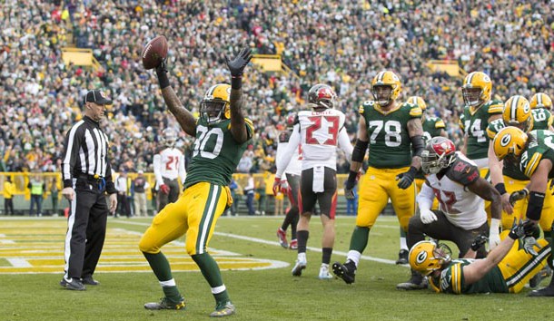 Dec 3, 2017; Green Bay, WI, USA; Green Bay Packers running back Jamaal Williams (30) celebrates after scoring a touchdown during the second quarter against the Tampa Bay Buccaneers at Lambeau Field. Mandatory Credit: Jeff Hanisch-USA TODAY Sports