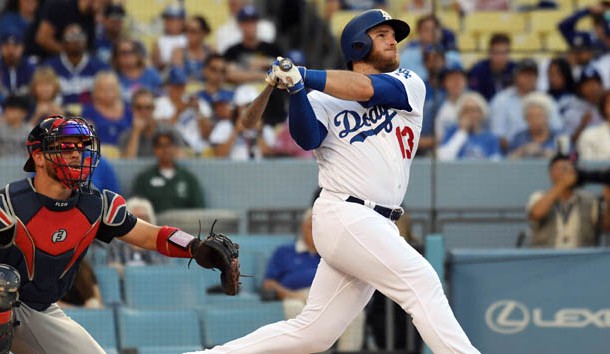 Jun 9, 2018; Los Angeles, CA, USA; Los Angeles Dodgers infielder Max Muncy (13) hits a solo home run against the Atlanta Braves in the first inning at Dodger Stadium. Photo Credit: Richard Mackson-USA TODAY Sports