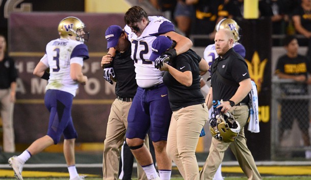 Oct 14, 2017; Tempe, AZ, USA; Washington Huskies offensive lineman Trey Adams (72) is helped off the field after being injured against the Arizona State Sun Devils during the first half at Sun Devil Stadium. Photo Credit: Joe Camporeale-USA TODAY Sports
