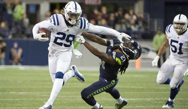 Oct 1, 2017; Seattle, WA, USA; Indianapolis Colts free safety Malik Hooker (29) stiff arms Seattle Seahawks cornerback DeAndre Elliott (21) as he runs back an interception during the second half at CenturyLink Field. The Seahawks won 46-18. Photo Credit: Troy Wayrynen-USA TODAY Sports