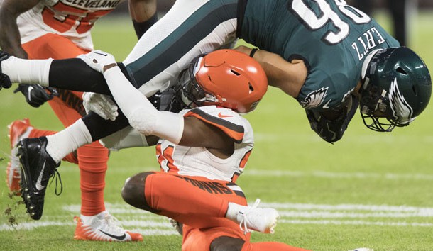 Aug 23, 2018; Cleveland, OH, USA; Cleveland Browns cornerback Denzel Ward (21) tackles Philadelphia Eagles tight end Zach Ertz (86) during the first quarter at FirstEnergy Stadium. Ward was injured on the play. Photo Credit: Ken Blaze-USA TODAY Sports