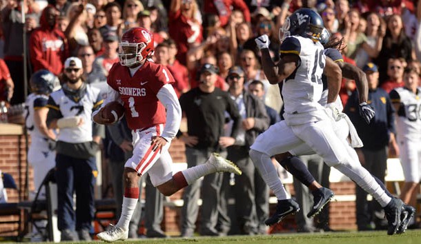 Nov 25, 2017; Norman, OK, USA; Oklahoma Sooners quarterback Kyler Murray (1) runs for a long gain in front of West Virginia Mountaineers cornerback Elijah Battle (19) during the first quarter at Gaylord Family - Oklahoma Memorial Stadium. Photo Credit: Mark D. Smith-USA TODAY Sports