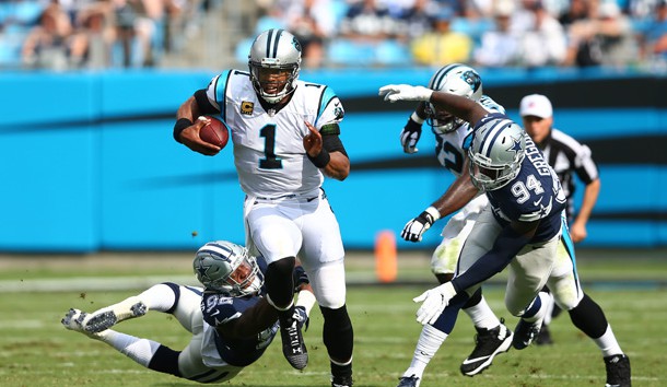 Sep 9, 2018; Charlotte, NC, USA; Dallas Cowboys defensive end Dorance Armstrong (92) attempts to bring down Carolina Panthers quarterback Cam Newton (1) in the first quarter at Bank of America Stadium. Mandatory Credit: Jeremy Brevard-USA TODAY Sports