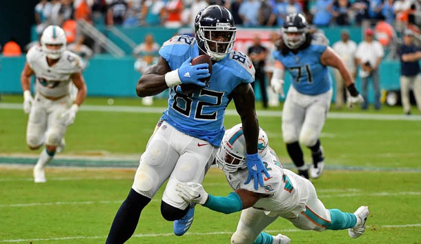 Sep 9, 2018; Miami Gardens, FL, USA; Tennessee Titans tight end Delanie Walker (82) avoids the tackle of Miami Dolphins cornerback Bobby McCain (28) during the second half at Hard Rock Stadium. Photo Credit: Jasen Vinlove-USA TODAY Sports