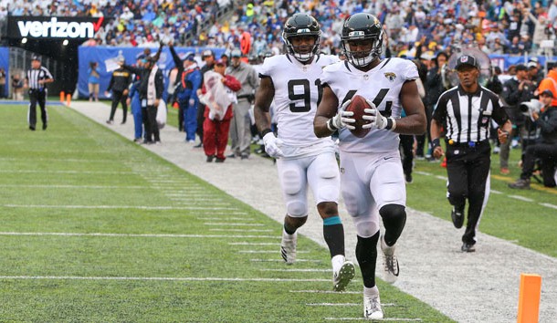 Sep 9, 2018; East Rutherford, NJ, USA; Jacksonville Jaguars linebacker Myles Jack (44) returns an interception for a touchdown in front of defensive end Yannick Ngakoue (91) during the second half at MetLife Stadium. Photo Credit: Vincent Carchietta-USA TODAY Sports